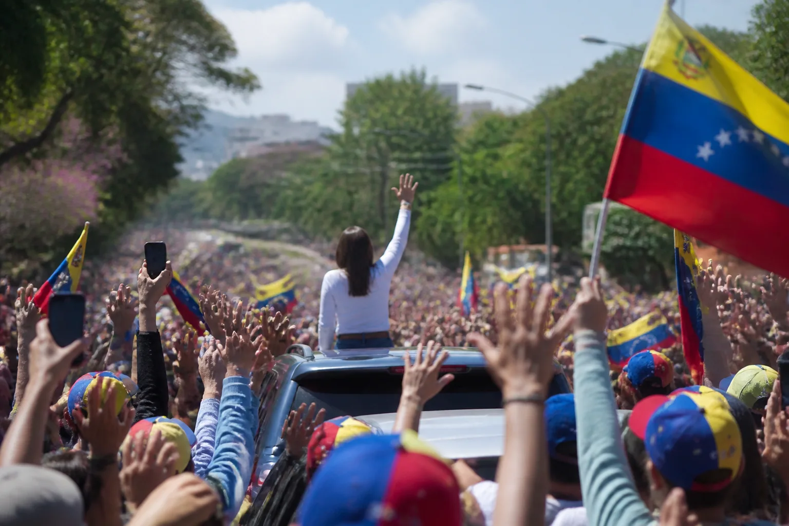 María Corina Machado returns to Venezuela to a reception from thousands